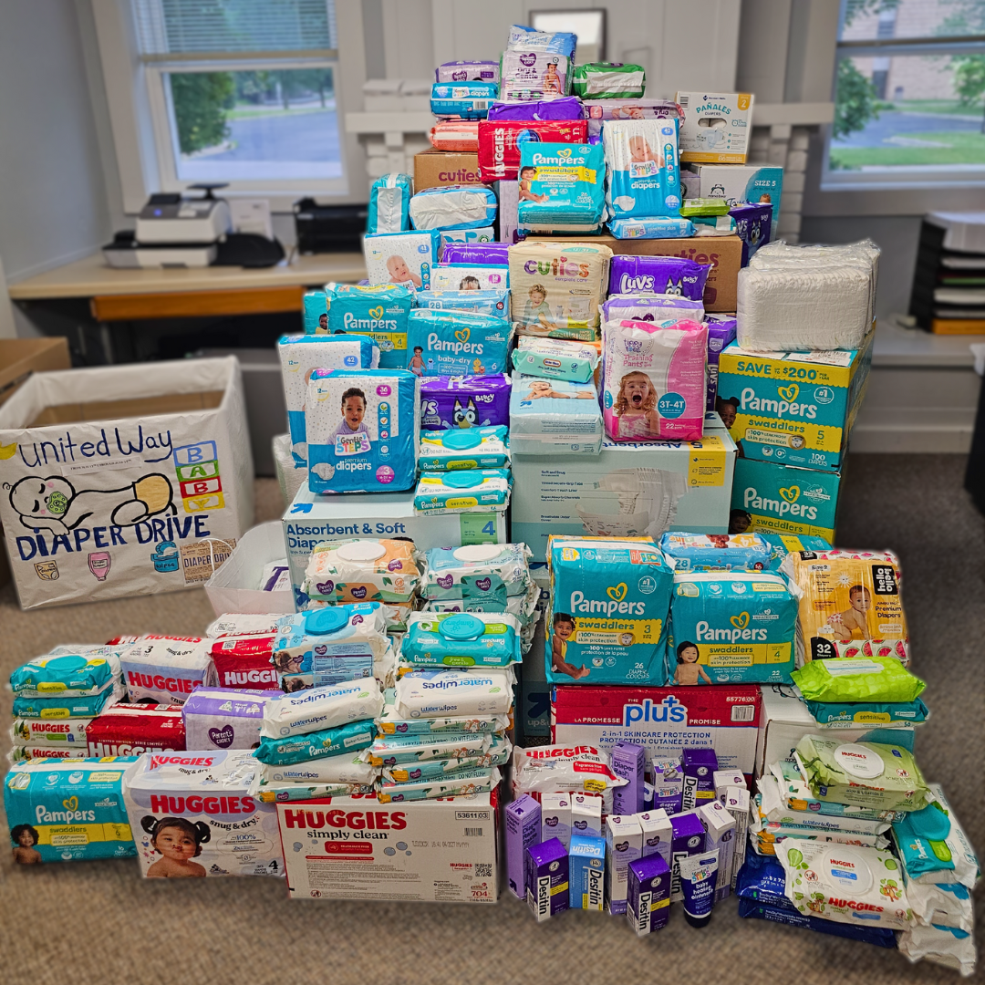 pile of diapers, creams, and wipes